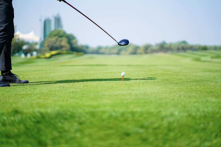 golf player focus before hitting golf ball with driver
