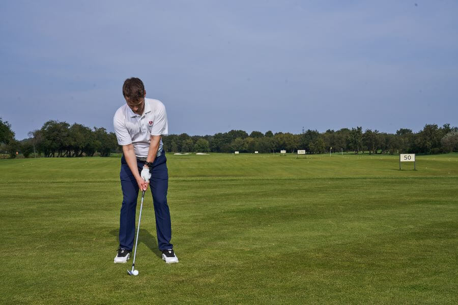 golfer on the golf course ready for iron shot