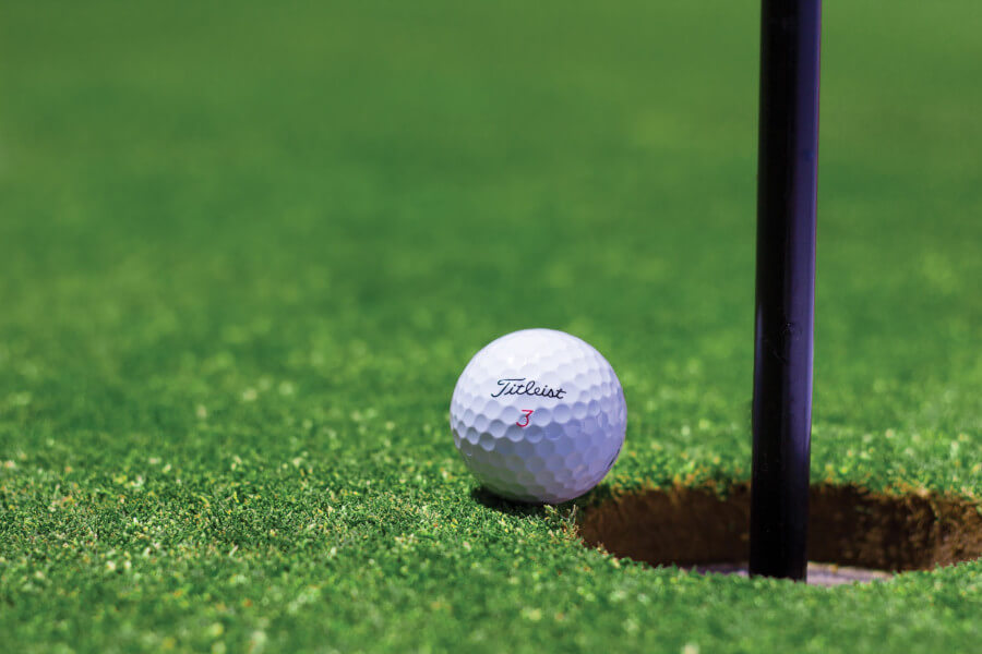 white golf ball on green grass field